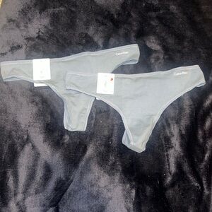 Two pairs of Calvin Klein thongs